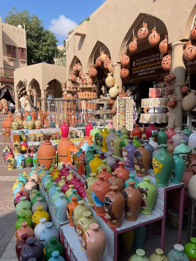 AMOUAGE: Full Day Private Trip to Nizwa and Al Jabal Akhdar - Nizwa Souq: Dates, Sweets, and a Market Beat in the Morning