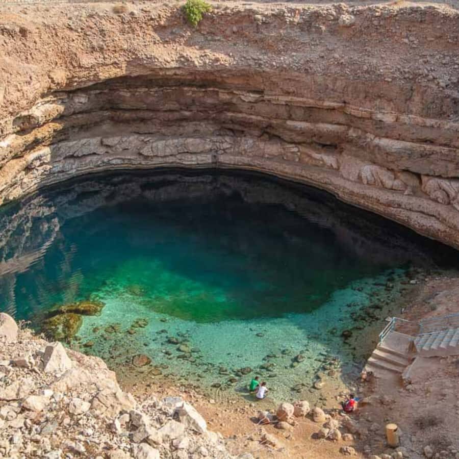 Muscat: Wadi Shab & Bimmah Sinkhole... - Wadi Shab canyon: the part with legs, shade, and turquoise pools
