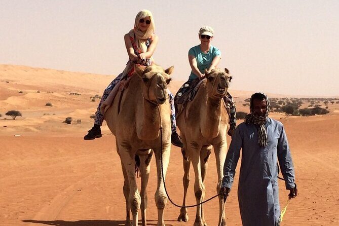 Private Full Day Tour to Wahiba Sands Desert and Wadi Hawer - Bedouin house visit: coffee, dates, and your chance to ride like locals