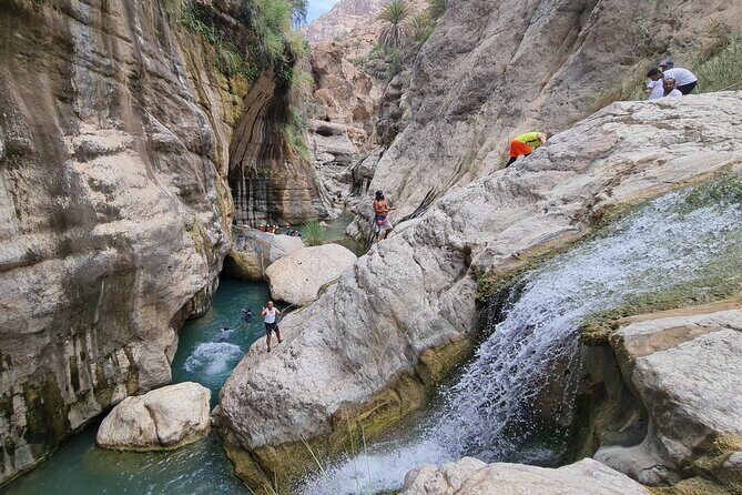 Private Full-Day Wadi Tiwi and Bimmah Sinkhole Tour from Muscat - Fins Beach: white, pebbly sand and the brightest blue you’ll see