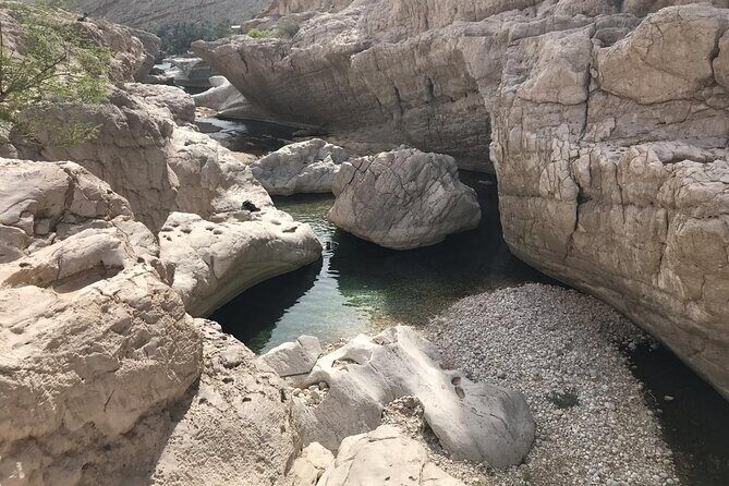 Tour Jawahir 2 Days-1 Night In Wahiba Sands, Oman Tours Package - Wadi Shab: canyon hike to pools, then a swim-through cave moment